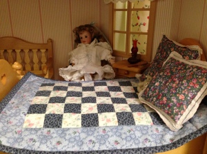 Wendy admiring the new doll quilt, which will be given away
